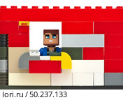 Man in window. Toy construction. Element of design. Стоковое фото, агентство Ingram Publishing / Фотобанк Лори
