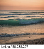 Soft waves lap against the shore as the sun sets, casting warm hues across the sky. The tranquil waters reflect the fading light, inviting relaxation and calmness Generative AI. Стоковое AI-изображение, AI-художник Юлия Петровская / Фотобанк Лори