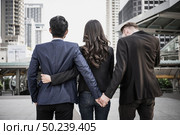 Image concept of a marital infidelity. Business people working together and man try to infidelity his couple. Стоковое фото, агентство Ingram Publishing / Фотобанк Лори