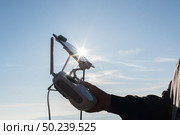 Young navigating a flying drone with remote control. Стоковое фото, агентство Ingram Publishing / Фотобанк Лори