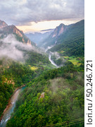 Montenegro, panorama mountains and of sunset sky . Canyon near city Zabljak . Стоковое фото, агентство Ingram Publishing / Фотобанк Лори