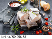 Raw fresh sliced hake fish with ingredients for cooking. Стоковое фото, агентство Ingram Publishing / Фотобанк Лори
