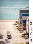 Working at Tsing yi Hong Kong Port for shipping and freight transportation with truck and boat for global business import and export background. Стоковое фото, агентство Ingram Publishing / Фотобанк Лори
