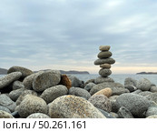 Cairn of smooth stones on the seashore. Harmony, meditation, contemplation. Стоковое фото, фотограф Кирилл Зотов / Фотобанк Лори
