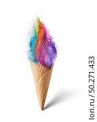 Waffle cone with ice cream in the shape of colorful rainbow dust explosion vertically standing on a light gray background with soft shadow, copy space.. Ice cream from multicolored dust explosion in a waffle cone. Стоковое фото, агентство Ingram Publishing / Фотобанк Лори