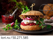Sandwiches, hamburgers with homemade wholemeal bread, herring, puree of beetroot, red onion, parsley and fresh lettuce salad. Стоковое фото, агентство Ingram Publishing / Фотобанк Лори