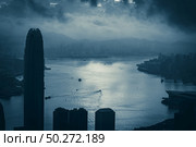 Hong Kong - April 25, 2020: Panorama of Victoria Harbor of Hong Kong city, cityscape with skyscraper. Редакционное фото, агентство Ingram Publishing / Фотобанк Лори
