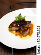Grilled Foie gras, grilled duck and goose live poultry, with plum savory sauce. Gourmet internationl cuisine recipe using for buffet food and drink concept.. Foie gras. Стоковое фото, агентство Ingram Publishing / Фотобанк Лори