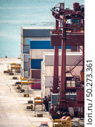 Working at Tsing yi Hong Kong Port for shipping and freight transportation with truck and boat for global business import and export background. Стоковое фото, агентство Ingram Publishing / Фотобанк Лори