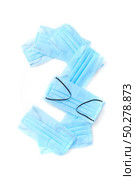 Figure 3, three handmade from medical antibacterial protective blue face masks on a white background, copy space. Creative typeface for making up new numerical information.. Number three made from protective medical masks on a white background. Стоковое фото, агентство Ingram Publishing / Фотобанк Лори
