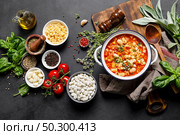 Cooking pasta e fagioli soup with chicken meat and vegetables, italian cuisine. Стоковое фото, агентство Ingram Publishing / Фотобанк Лори