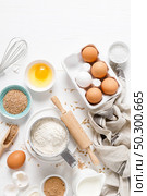 Baking homemade bread on white kitchen worktop with ingredients for cooking, culinary background, copy space, overhead view. Стоковое фото, агентство Ingram Publishing / Фотобанк Лори