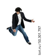 Young modern man jumping over a white background. Стоковое фото, агентство Ingram Publishing / Фотобанк Лори