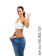 Woman with large jeans in dieting concept. Стоковое фото, агентство Ingram Publishing / Фотобанк Лори