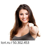 Portrait of a beautiful young woman pointing to somewhere, isolated on white. Стоковое фото, агентство Ingram Publishing / Фотобанк Лори