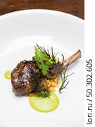 Grilled lamb chop with pesto sauce, international gourmet cuisine a la carte in buffet live station. Using for food and drink industry.. Grilled lamb chop. Стоковое фото, агентство Ingram Publishing / Фотобанк Лори