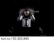 close-up microscope isolated on black background. Стоковое фото, агентство Ingram Publishing / Фотобанк Лори