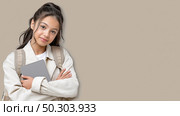 Young student poses confidently with a tablet in a neutral setting. студентка, ученица, школьница уверенно позирует с планшетом в нейтральной обстановке. Стоковое AI-изображение, AI-художник Katsiaryna Repich / Фотобанк Лори