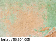 Old wall with peeling paint green. Old textured concrete wall painted green color. Стоковое фото, агентство Ingram Publishing / Фотобанк Лори