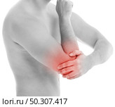 Man is touching his back because it aches. Стоковое фото, агентство Ingram Publishing / Фотобанк Лори