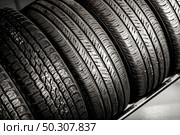 New Compact Vehicles Tires Stack. Winter and Summer Season Tires. Стоковое фото, агентство Ingram Publishing / Фотобанк Лори
