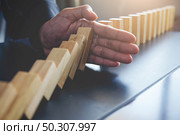 Concept of solution and domino effect.Slightly de-focused and close-up shot. Selective focus. . Стоковое фото, агентство Ingram Publishing / Фотобанк Лори
