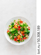 Quinoa and broccoli vegetable salad with baked butternut squash or pumpkin, green peas, bell pepper and parsley. Стоковое фото, агентство Ingram Publishing / Фотобанк Лори