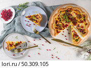 Homemade vegetable quiche with goat cheese, brussels sprouts and pomegranate seeds. Стоковое фото, агентство Ingram Publishing / Фотобанк Лори