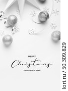 New Years party remnants with silver tones on a white elegant background. Стоковое фото, агентство Ingram Publishing / Фотобанк Лори