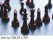 Chess pieces board game in business success leadership concept. Стоковое фото, агентство Ingram Publishing / Фотобанк Лори