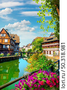 Picturesque district Petite France in Strasbourg, houses on river. Стоковое фото, агентство Ingram Publishing / Фотобанк Лори