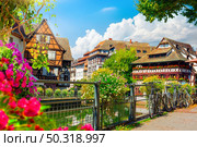Picturesque district Petite France in Strasbourg, houses on river. Стоковое фото, агентство Ingram Publishing / Фотобанк Лори