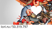 Seafood heart shape and Sea food background or fresh shellfish as lobster steamed clams mussels shrimp and crab sardines octopus as an ocean catch of the day gourmet dinner with copyspace. Стоковое фото, агентство Ingram Publishing / Фотобанк Лори