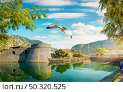 Famous Bastion Riva in Kotor at sunrise. Стоковое фото, агентство Ingram Publishing / Фотобанк Лори