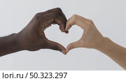 black white hands making heart shape. Стоковое фото, агентство Ingram Publishing / Фотобанк Лори