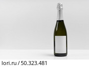 champagne bottle with white background. Стоковое фото, агентство Ingram Publishing / Фотобанк Лори
