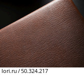 extreme close up brown leather black background. Стоковое фото, агентство Ingram Publishing / Фотобанк Лори
