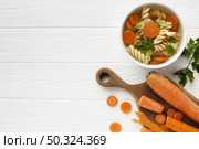 flat lay fusilli broccoli carrots bowl with copy space. Стоковое фото, агентство Ingram Publishing / Фотобанк Лори