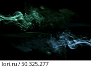 realistic green blue smoke black background . Resolution and high quality beautiful photo. realistic green blue smoke black background . High quality and resolution beautiful photo concept. Стоковое фото, агентство Ingram Publishing / Фотобанк Лори