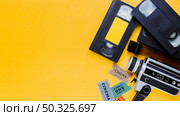 videotape with vintage videocamera and cinema tickets. Resolution and high quality beautiful photo. videotape with vintage videocamera and cinema tickets. High quality and resolution beautiful photo concept. Стоковое фото, агентство Ingram Publishing / Фотобанк Лори