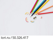 bright pencils near sharpener shaving. Resolution and high quality beautiful photo. bright pencils near sharpener shaving. High quality beautiful photo concept. Стоковое фото, агентство Ingram Publishing / Фотобанк Лори