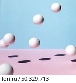 front view ping pong balls bouncing around. High resolution photo. front view ping pong balls bouncing around. High quality photo. Стоковое фото, агентство Ingram Publishing / Фотобанк Лори