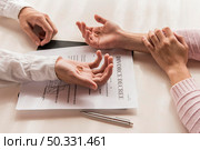 high angle hands divorce decree. High resolution photo. high angle hands divorce decree. High quality photo. Стоковое фото, агентство Ingram Publishing / Фотобанк Лори