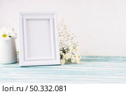 OLYMPUS DIGITAL CAMERA. High resolution photo. flowers with blank frame table. High quality photo. Стоковое фото, агентство Ingram Publishing / Фотобанк Лори