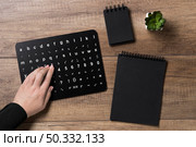 hand reading braille alphabet board. High resolution photo. hand reading braille alphabet board. High quality photo. Стоковое фото, агентство Ingram Publishing / Фотобанк Лори