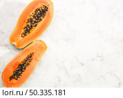 halves papaya fruit with copy space. Стоковое фото, агентство Ingram Publishing / Фотобанк Лори