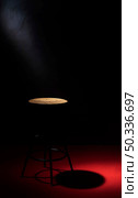 high angle chair with copy space spotlight. Стоковое фото, агентство Ingram Publishing / Фотобанк Лори