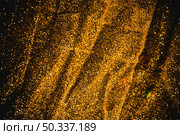 bright sequins scattered black table. Стоковое фото, агентство Ingram Publishing / Фотобанк Лори