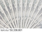 one hundred dollars bills spread out fan shape. Стоковое фото, агентство Ingram Publishing / Фотобанк Лори
