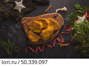 Traditional Christmas Rabanadas with egg yolk cream and cinnamon. Spanish Torrijas close up on the countertop. Стоковое фото, агентство Ingram Publishing / Фотобанк Лори